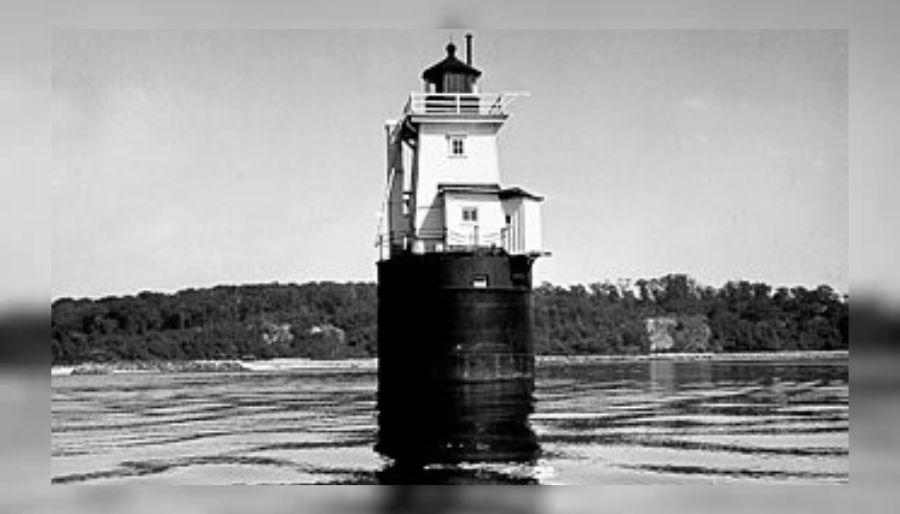 Historic black-and-white photograph of Cold Spring Harbor Lighthouse standing offshore before its relocation to Centre Island.